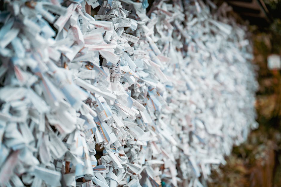 A local train in Japan wrapped in a vibrant anime livery, promoting a series and its setting