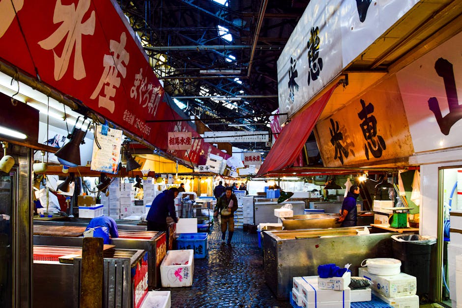 A vendor carefully preparing delicate tamagoyaki, representing the specialized skills found throughout the market